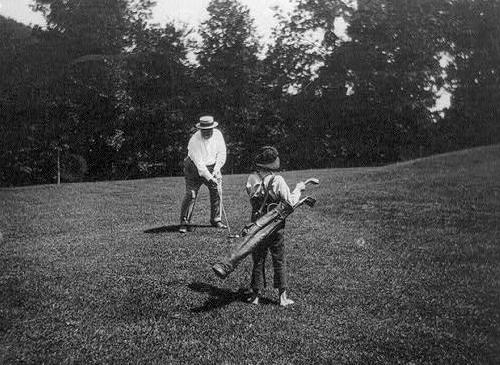 A photo of President Taft playing golf.