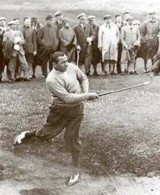 Walter Hagen playing a bunker shot with a hickory shafted iron.