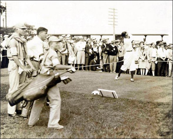 A vintage photo fo Johnny Farrell at Olympia Fields, Bobby Jones front left.