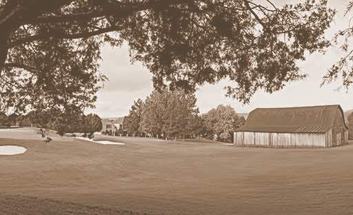 A vintage photo of the green keeper's barn.
