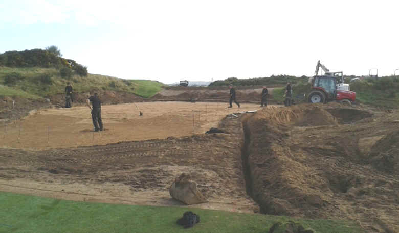 A photo showing a golf course green being rebuilt.